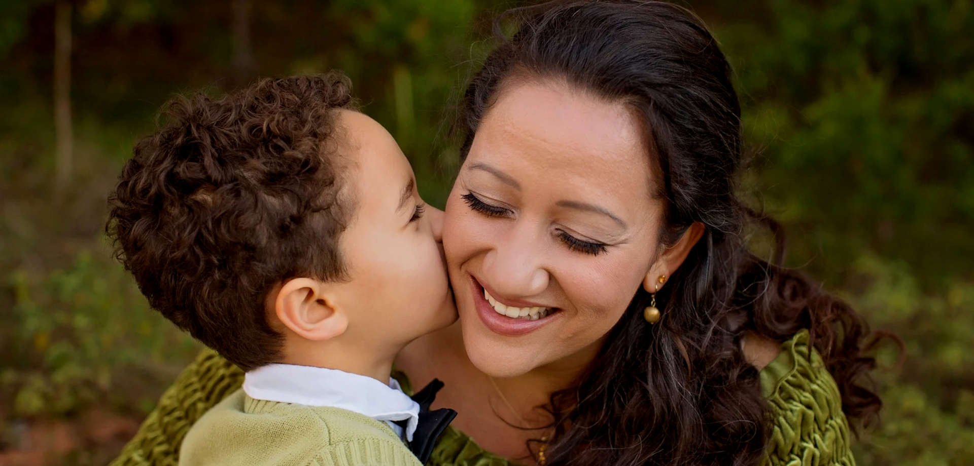 Son giving his Mom a kiss on the cheek